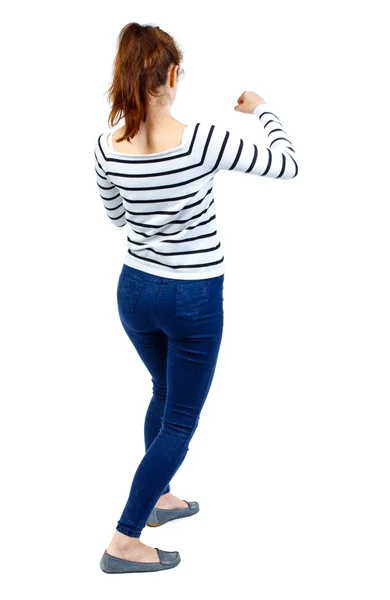 Back view of woman funny fights waving his arms and legs. — Stock Photo, Image