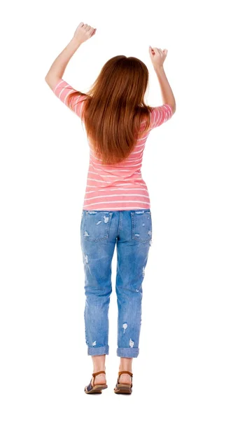 Achteraanzicht van vrolijke vrouw vieren overwinning handen omhoog. — Stockfoto