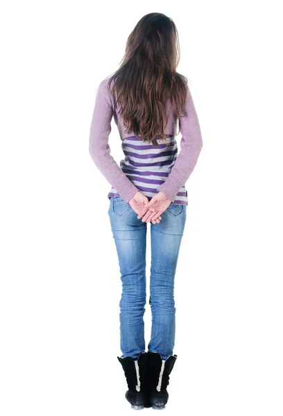 Schöne junge Frau mit Blick auf die Wand. Rückansicht. — Stockfoto