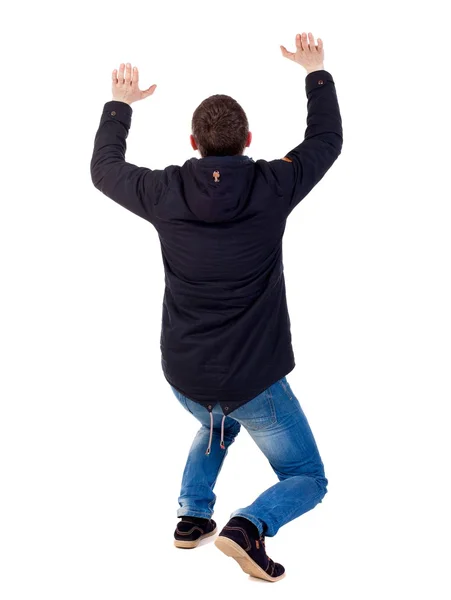 Back view of business man protects hands from what is falling fr — Stock Photo, Image