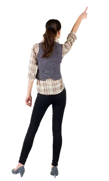 Back view of young brunette woman pointing — Stock Photo, Image