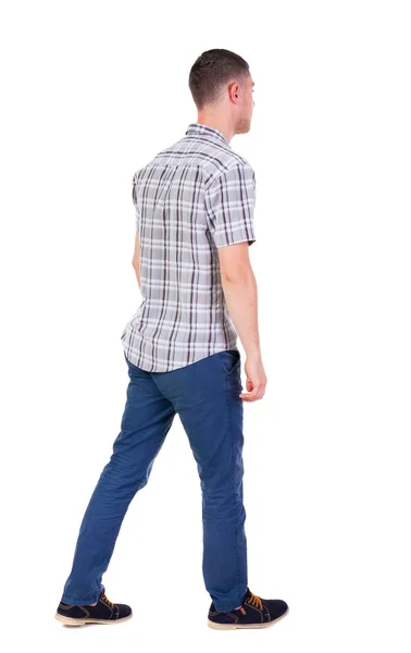Visão traseira de ir homem bonito em jeans e uma camisa . — Fotografia de Stock