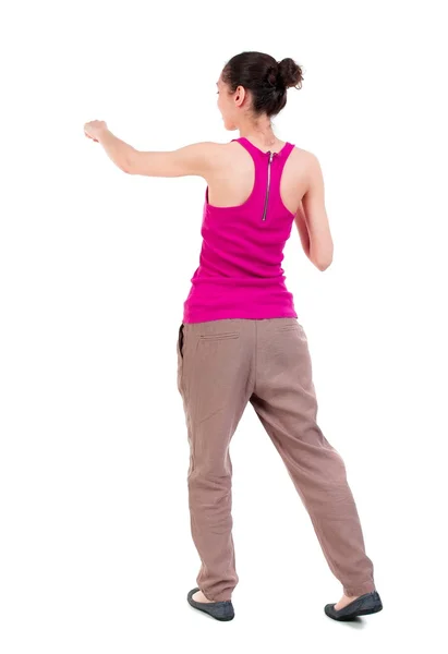 Back view of woman funny fights waving his arms and legs. — Stock Photo, Image