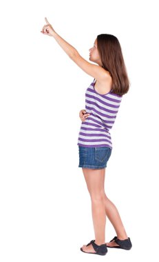 arkadan görünüşü işaret eden kadın.