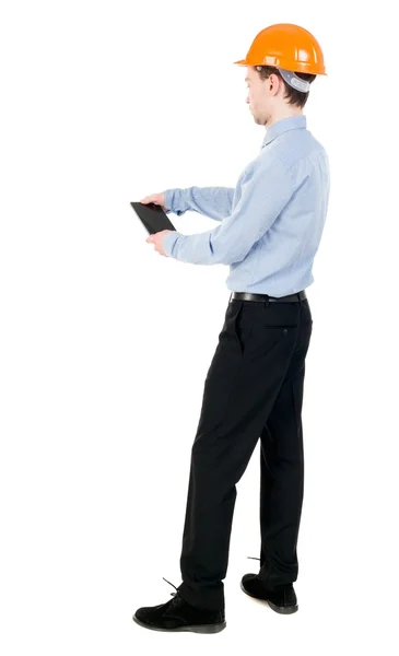 Backview of business man in construction helmet stands and enjoy — Stock Photo, Image