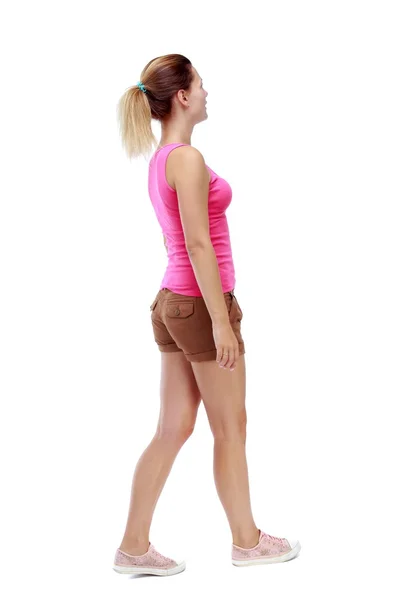Back view of walking  woman. beautiful blonde girl in motion. — Stock Photo, Image