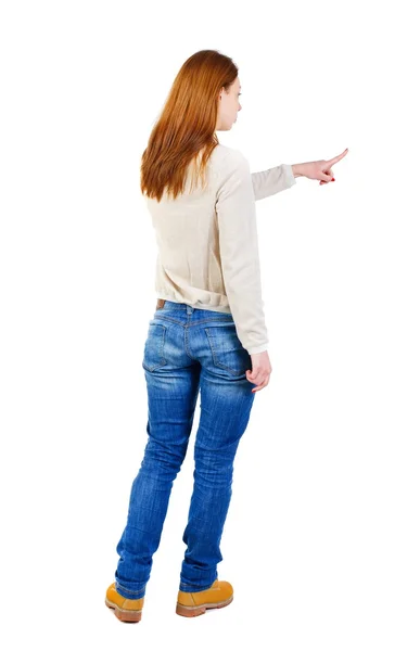 Vista posteriore della donna indicante. Bella ragazza. — Foto Stock