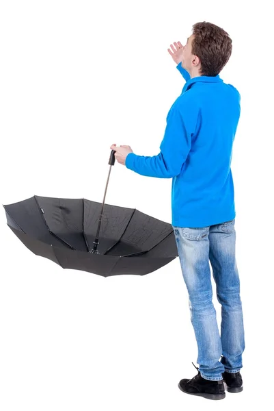 한 우산 아래 흰색 니트 스웨터에 있는 젊은이 — 스톡 사진
