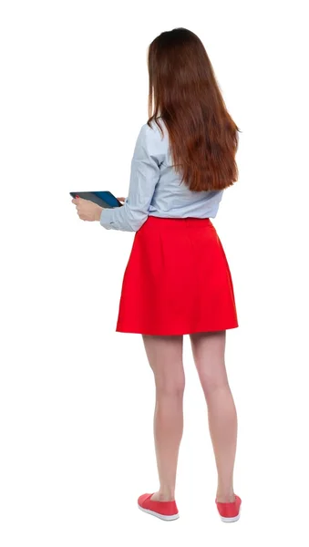 Back view of standing young beautiful  woman using a mobile phon — Stock Photo, Image