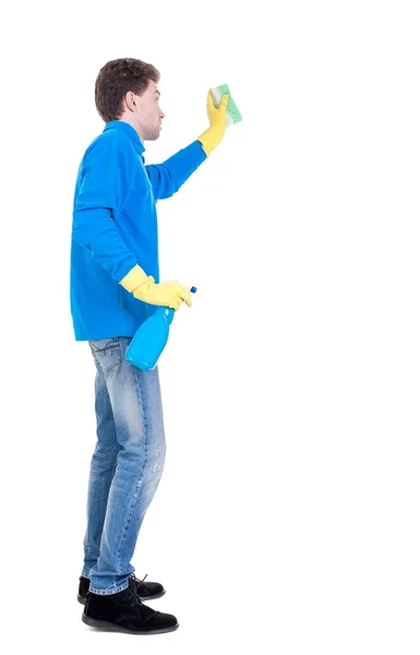 Side view of a cleaner man in gloves with sponge and detergent. — Stock Photo, Image