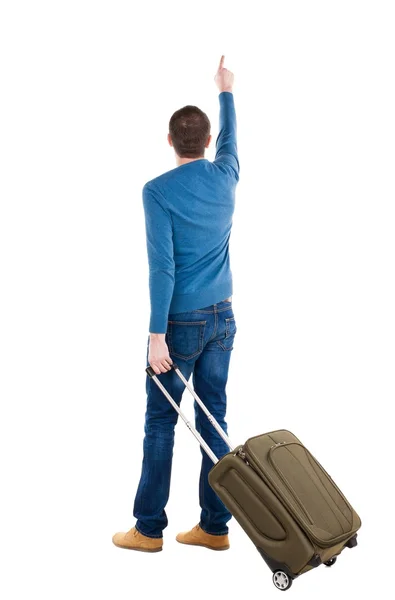 Widok człowieka wskazujące z walizka z tyłu. — Zdjęcie stockowe