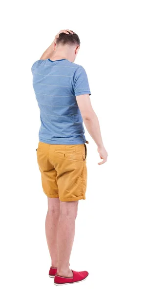 Rückansicht des Angry Young Man in Shorts und t-shirt. — Stockfoto