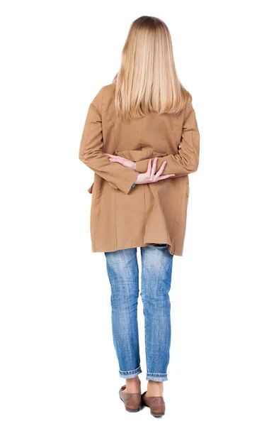 Back view of standing young beautiful  blonde woman in brown clo — Stock Photo, Image