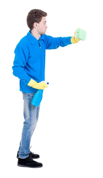 Side view of a cleaner man in gloves with sponge and detergent. — Stock Photo, Image