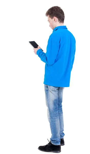 Back view of business man uses mobile phone. – stockfoto