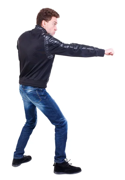 Back view of guy funny fights waving his arms and legs. — Stock Photo, Image