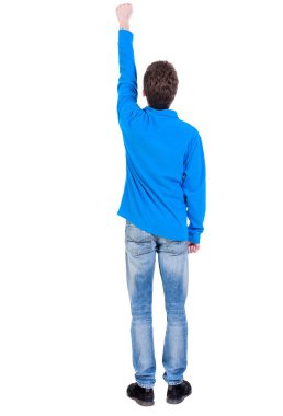 arkadan görünüşü adam. zafer işareti yumruğunu kaldırdı.