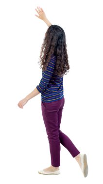 back view of walking woman welcomes.