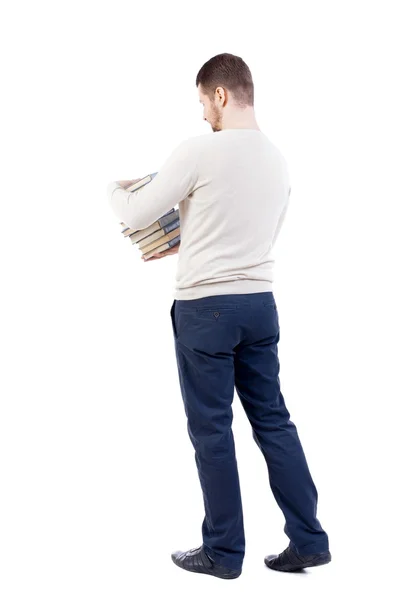 Man carries heavy pile of books. — Stock Photo, Image