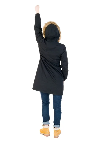 Back view of  pointing young women in parka. — Stock Photo, Image