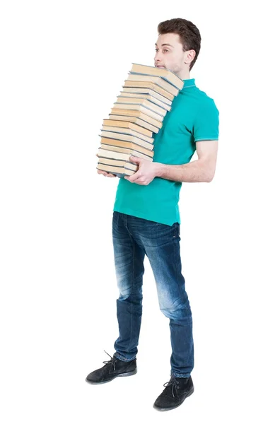 Back view of going  handsome man carries a stack of books. — Stock Photo, Image