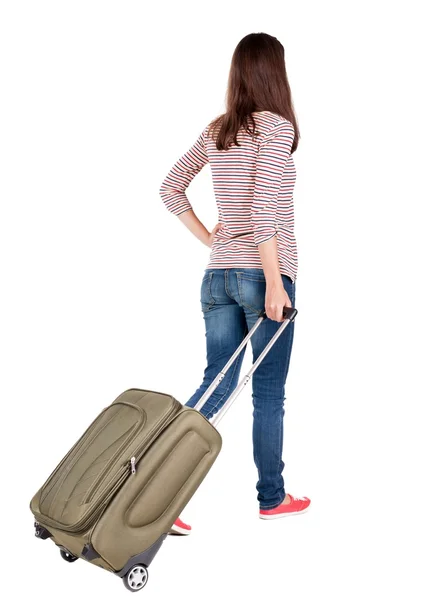 Back view of walking  woman  with suitcase. — Fotografia de Stock