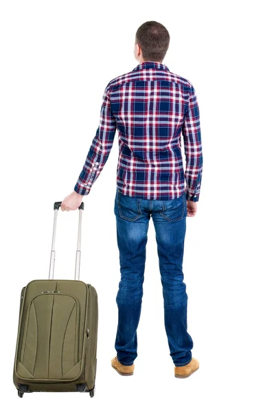 Назад точка зрения человека с зеленым чемоданом поиск. — стоковое фото