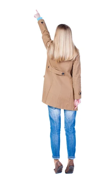 Bakifrån pekar womanin brun kappa. — Stockfoto