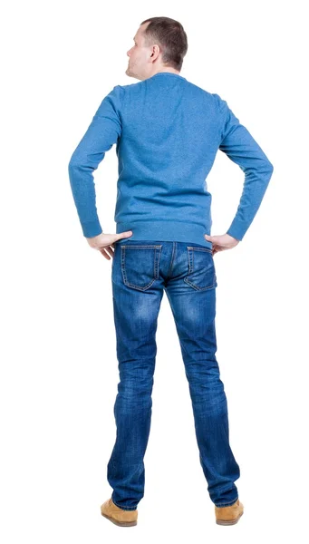Back view of handsome man in blue pullover looking up. — Stock Photo, Image