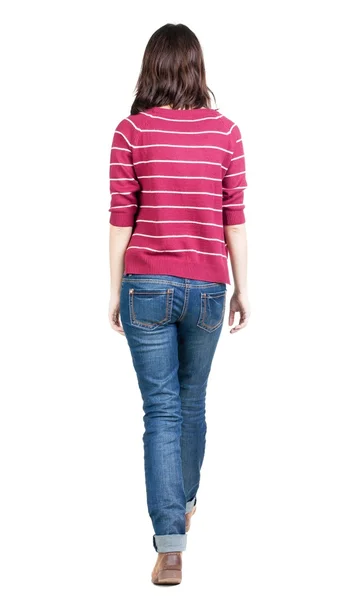 Back view of walking  woman in striped sweater. — Stock Photo, Image