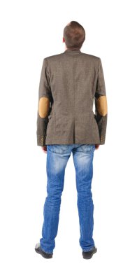 Arkadan görünüş iş erkek ceket giymiş. adam duvara benziyor.