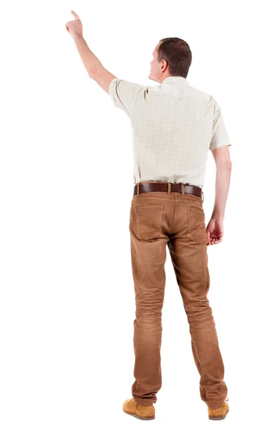 Задний вид указания молодых людей в рубашке и джинсах — стоковое фото