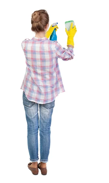 Vista posterior de un ama de casa en guantes con esponja y detergente —  Fotos de Stock