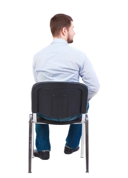 Vista posterior de hombre de negocios sentado en silla. — Foto de Stock