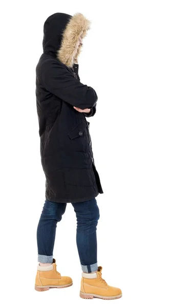 Προβολή πίσω γυναίκα στο χειμερινό μπουφάν, κοιτώντας ψηλά — Φωτογραφία Αρχείου
