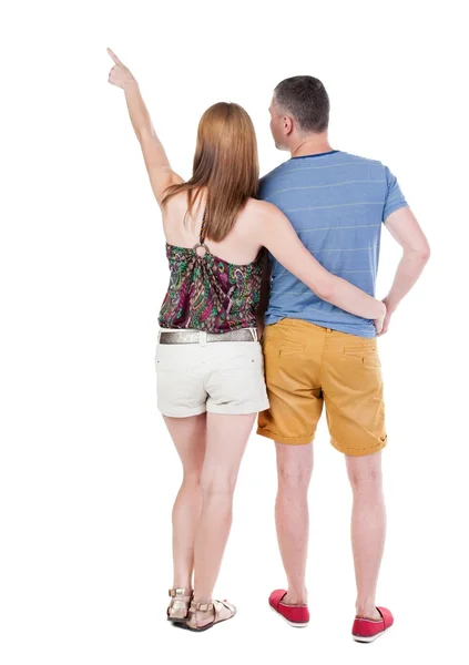 Casal jovem apontando . — Fotografia de Stock