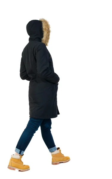 Back view of going  woman in parka. — Stock Photo, Image