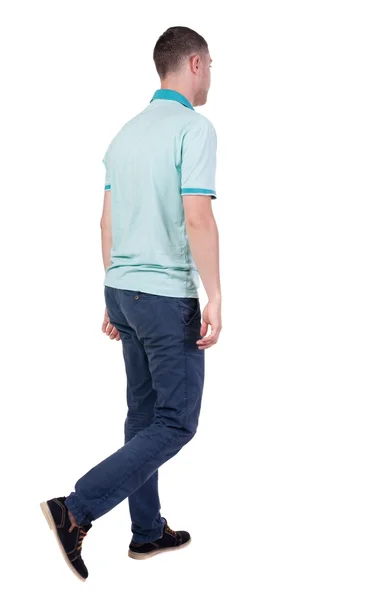 Back view of going  handsome man in jeans and a shirt. — Stock Photo, Image