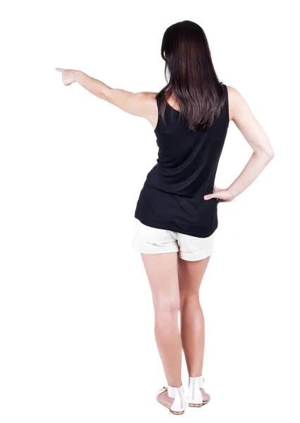 Back view of  pointing woman. — Stock Photo, Image