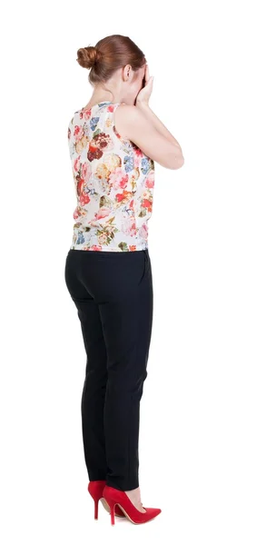 Achteraanzicht van geschokt vrouw in broek. — Stockfoto