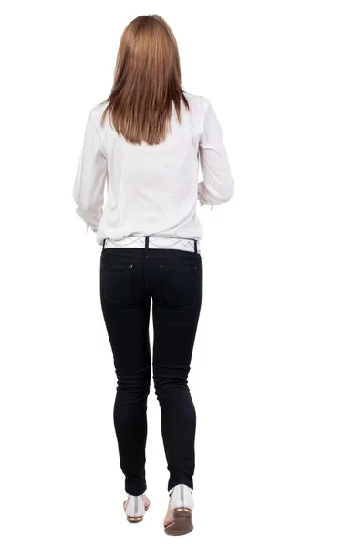 Back view of running  woman in jeans — Stock Photo, Image