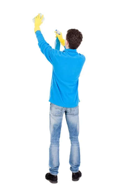 Tył widok czystsze człowieka w rękawice z gąbki i detergentów. — Zdjęcie stockowe