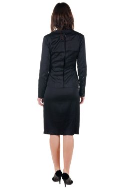 güzel genç bayan duvara bakıyor. arka görünüm.