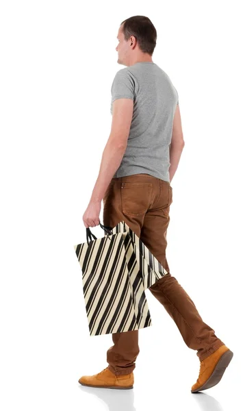 Back view of going  handsome man with shopping bags. — Stock Photo, Image