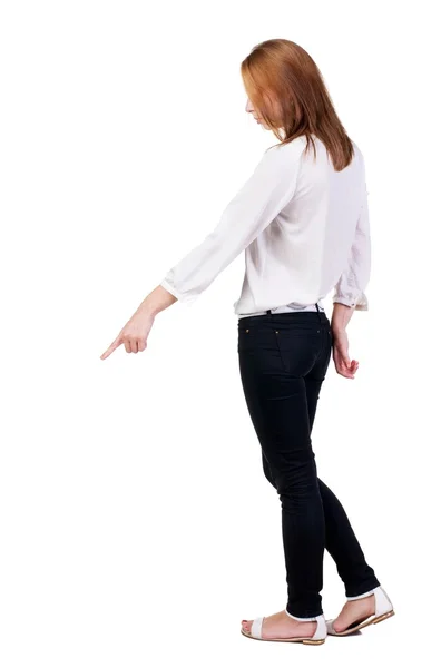 Back view of  pointing woman. — Stock Photo, Image