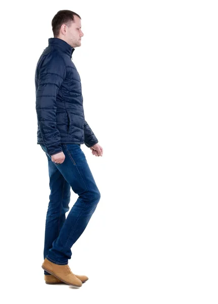 Vista de cara bonito em jeans e jaqueta de volta. — Fotografia de Stock