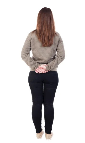 Vista posteriore di in piedi giovane bella donna in jeans . — Foto Stock