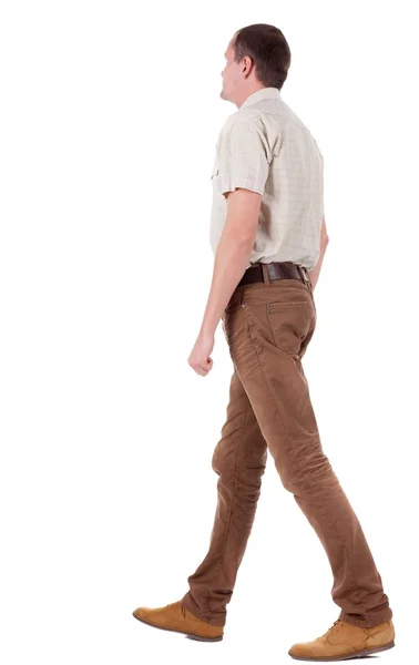 Back view of going  handsome man in jeans and a shirt — Stock Photo, Image
