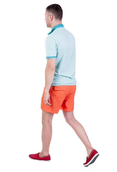 Back view of going  handsome man in shorts.  walking young guy — Stock Photo, Image