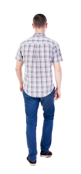 Οπίσθια όψη της μετάβασης των όμορφος άντρας με τζιν και ένα πουκάμισο. — Φωτογραφία Αρχείου